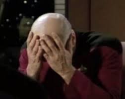 The meme is a still image from the TV show Star Trek: The Next Generation. It depicts Captain Jean-Luc Picard with his hands covering his face, as if in shock or frustration. The image is captioned "I'm...I'm...I'm...".